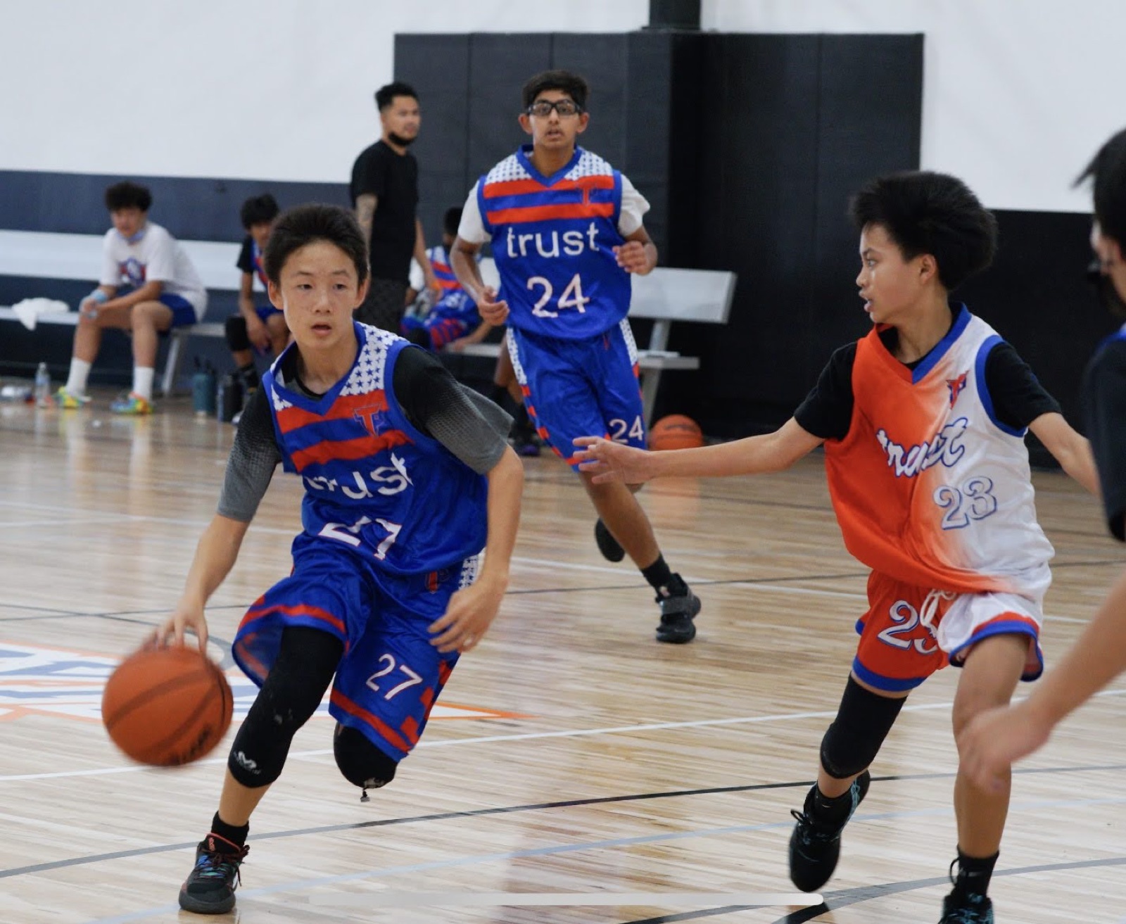 Jadon driving baseline in a Trust AAU jersey, #27