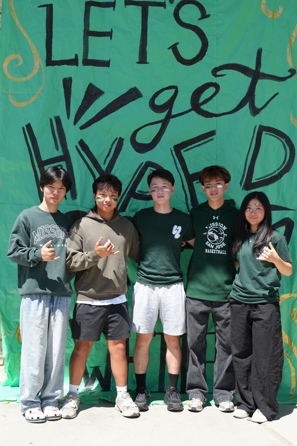The L2 video committee in front of the Let's Get Hyped mural