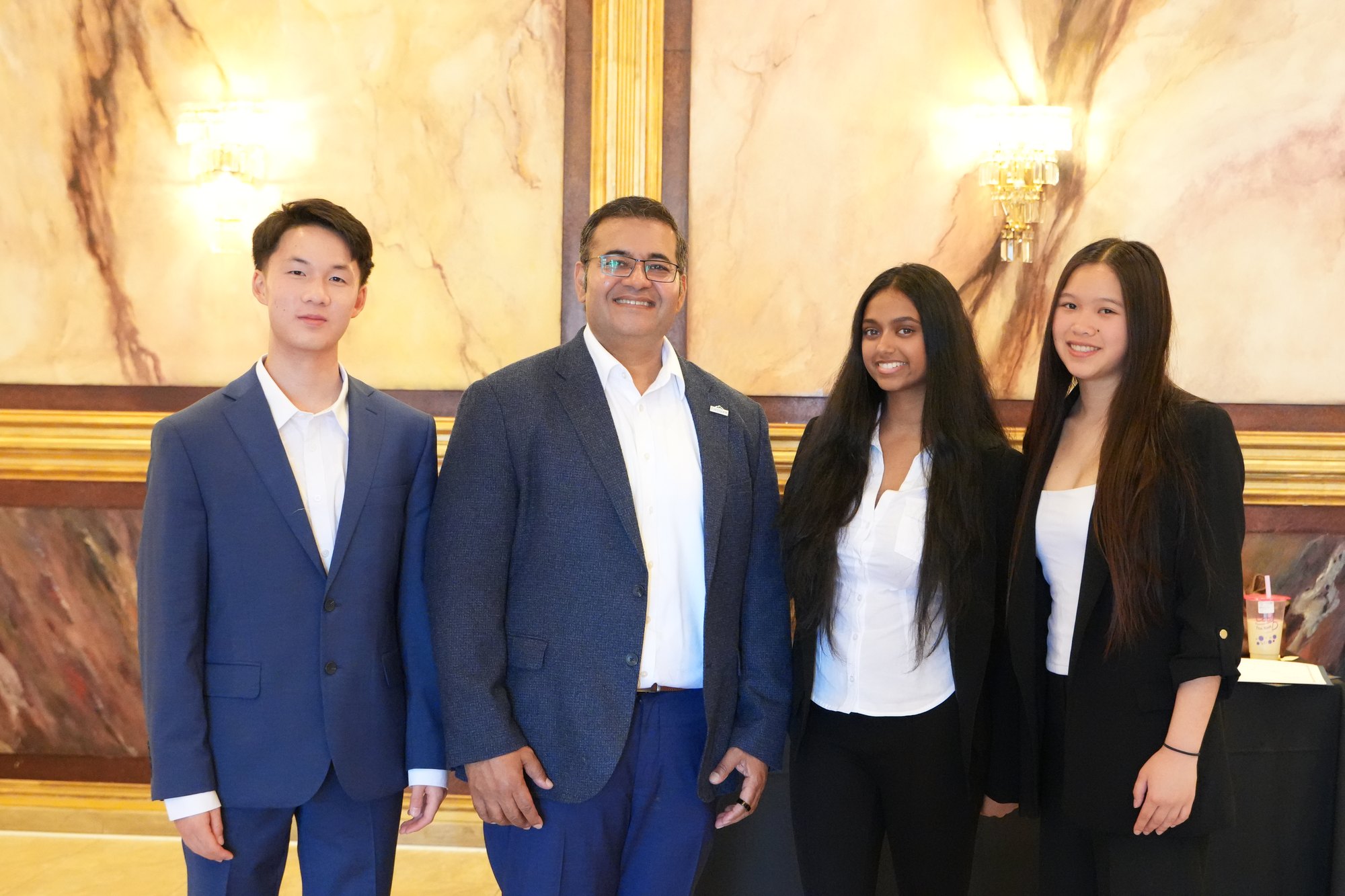 Jadon Li with Mayor Raj Salwan and the two other lead interns