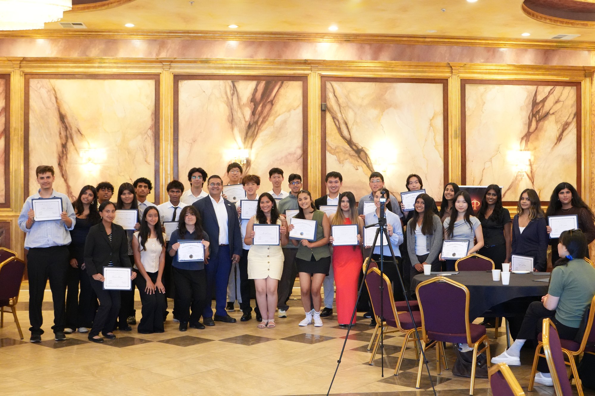 The full 2026 cohort of Mayor Salwan's intern program holding their certificates of completion